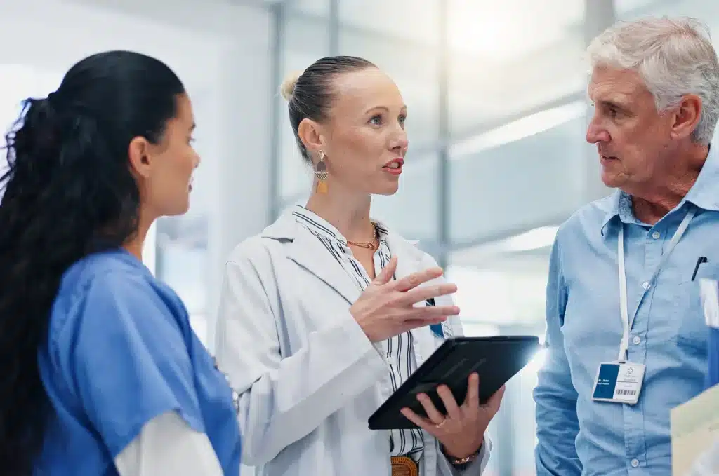 Doctors, team and tablet for hospital management