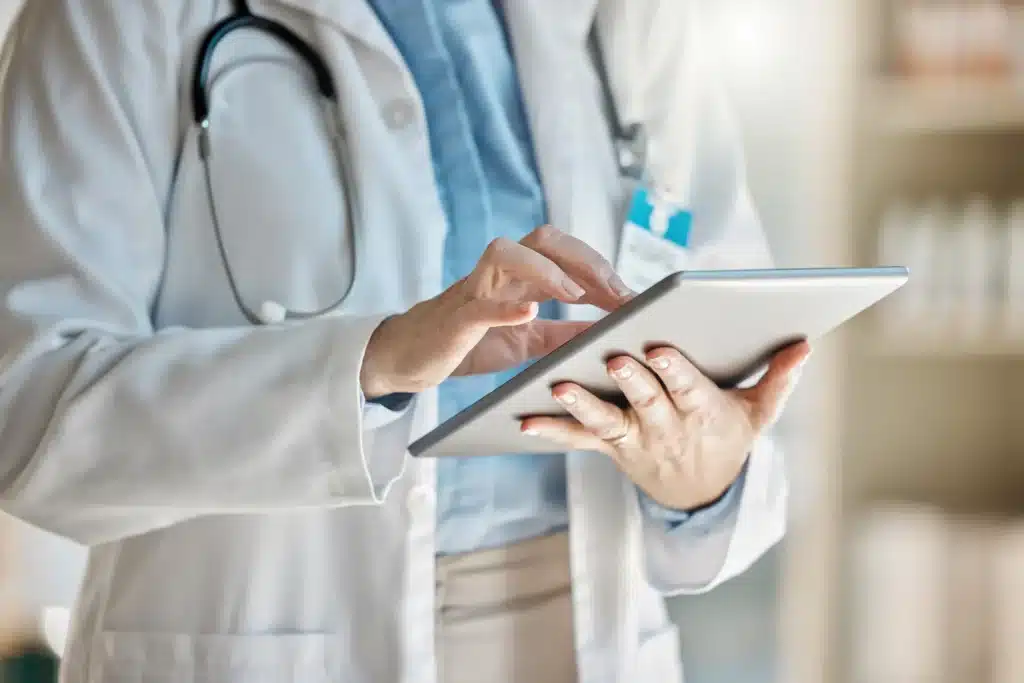 Doctor, office and tablet for research, email or communication