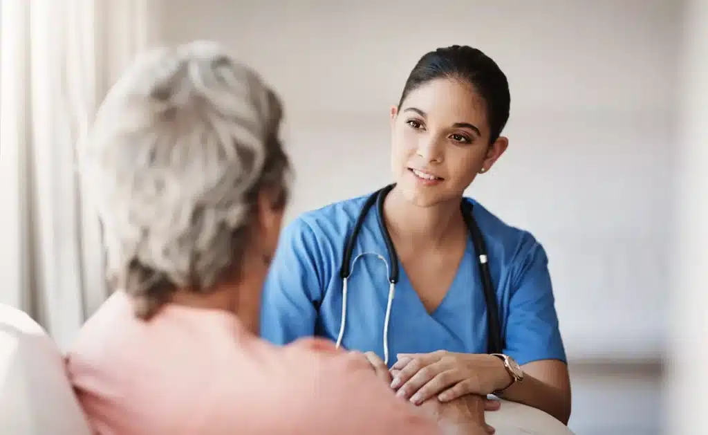 nurse with a senior patient explaining a diagnosis